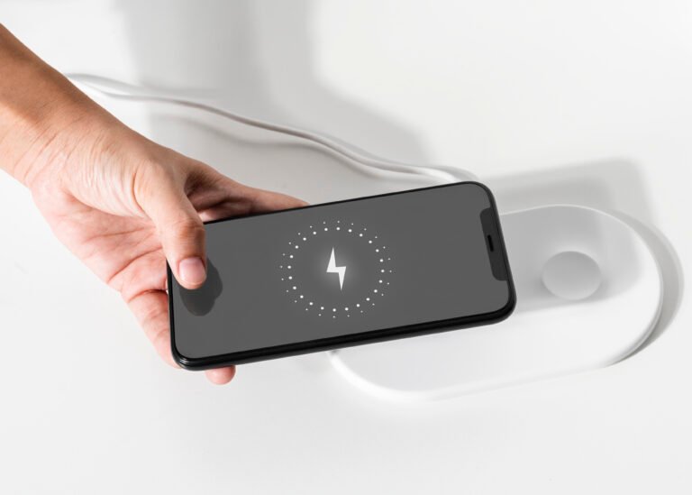 hand connecting smartphone wireless charger